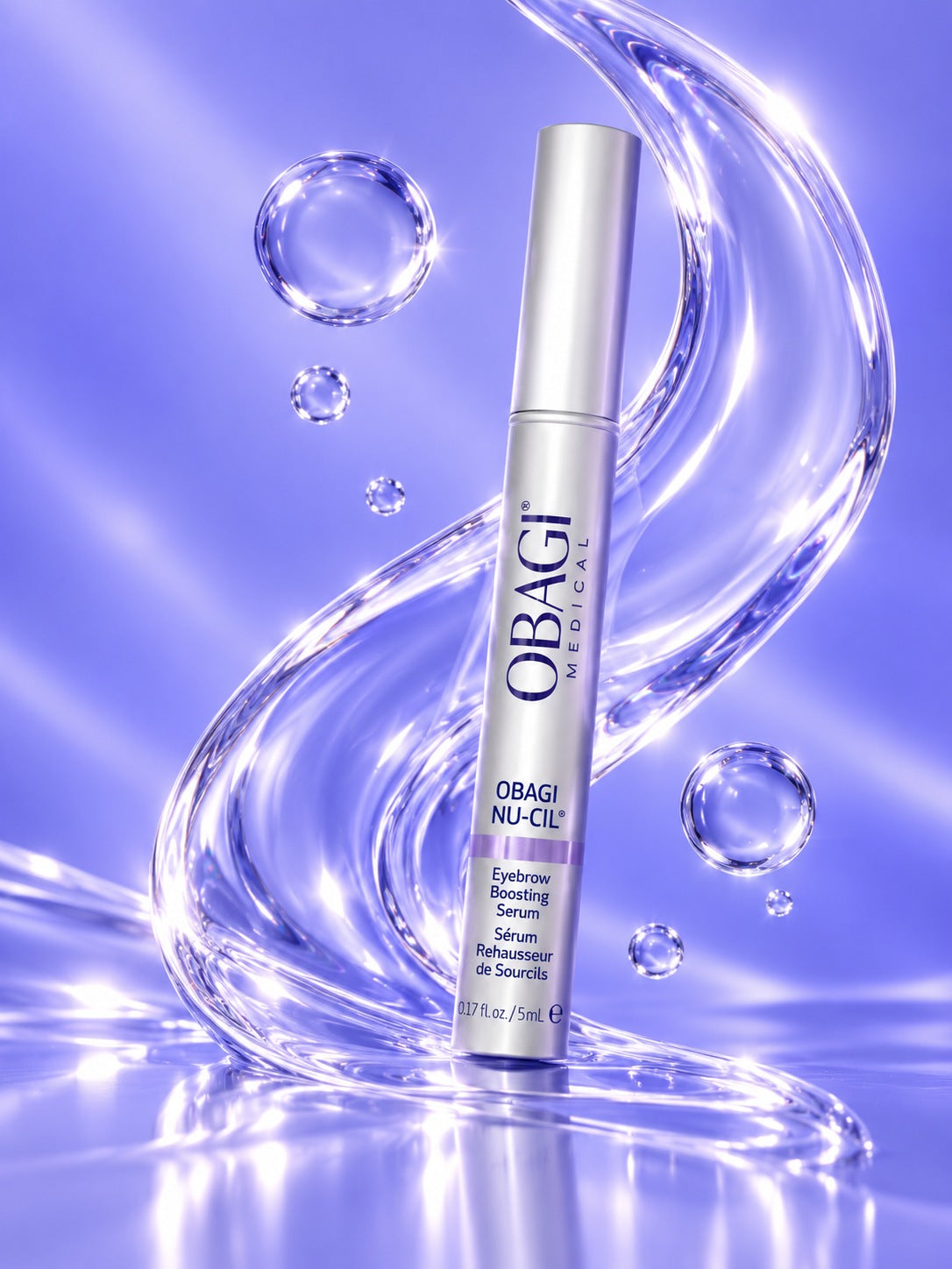 Obagi Nu-Cil Eyebrow Boosting Serum with magnified clear droplets in violet light